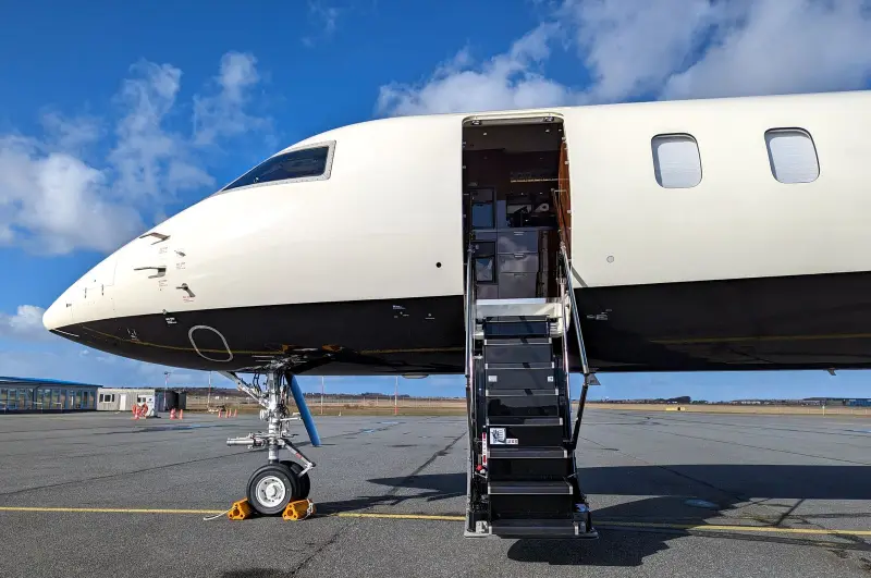Placeholder photo of a private jet on a sunny ramp with its airstair lowered
